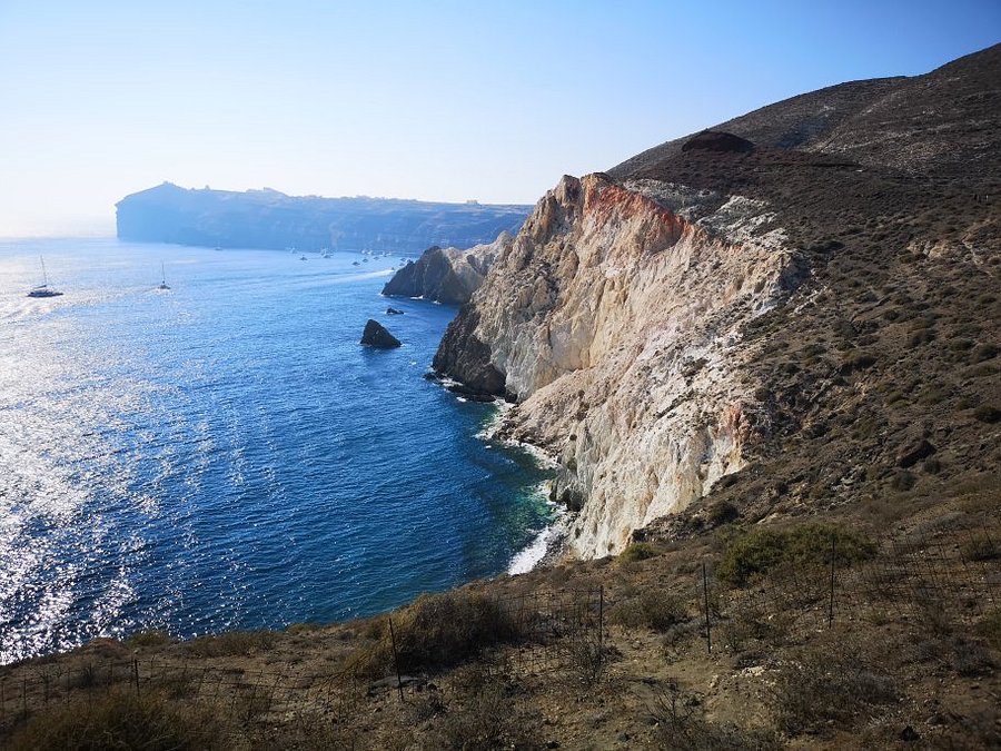 White Beach Santorini secluded cove with towering white cliffs and crystal clear water